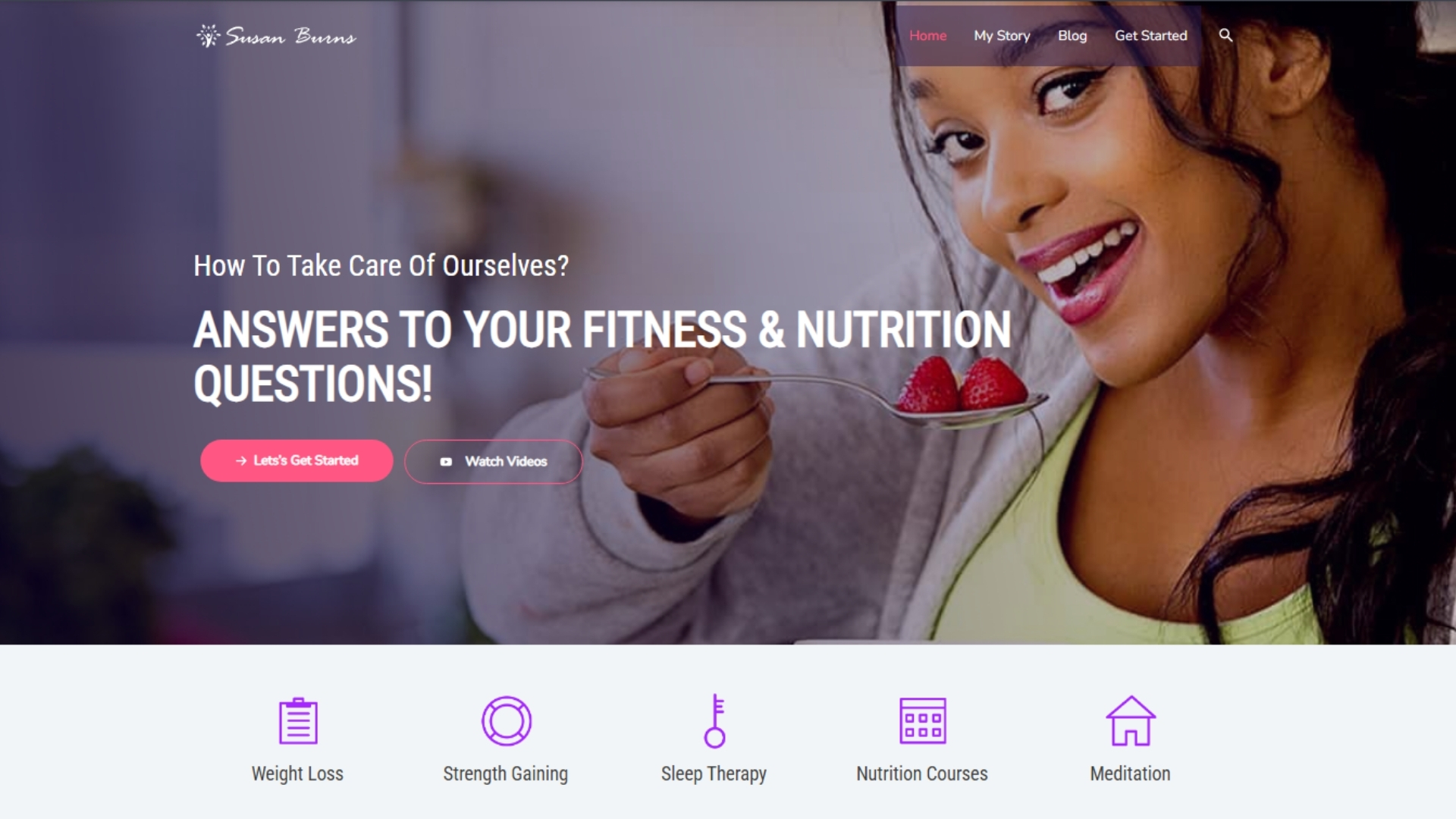 Smiling woman holding a spoon with strawberries, representing healthy eating and nutrition tips on Susan Burns' wellness website focused on fitness and self-care.